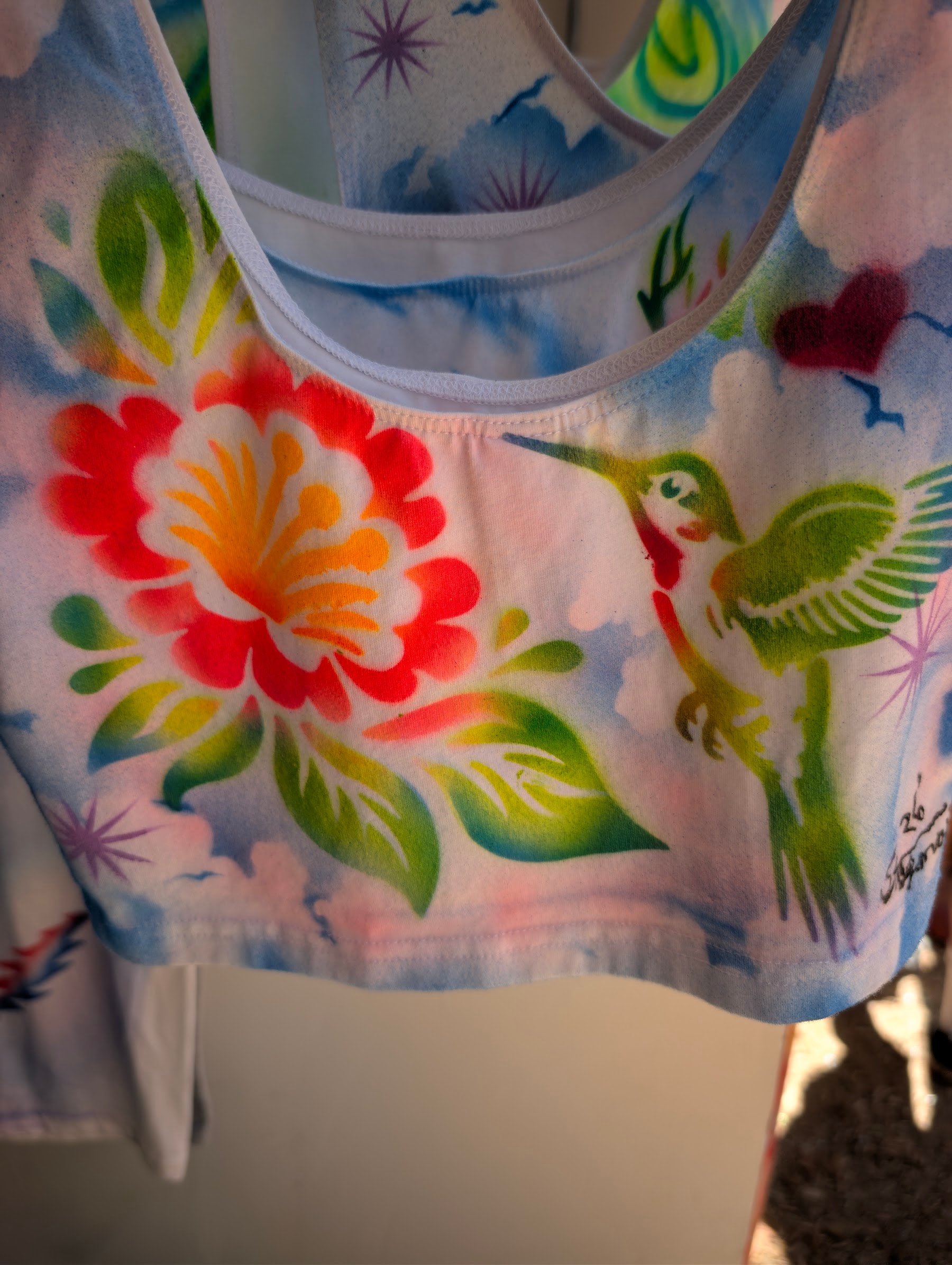 Hand-airbrushed top with a hummingbird and flower by Star Shields