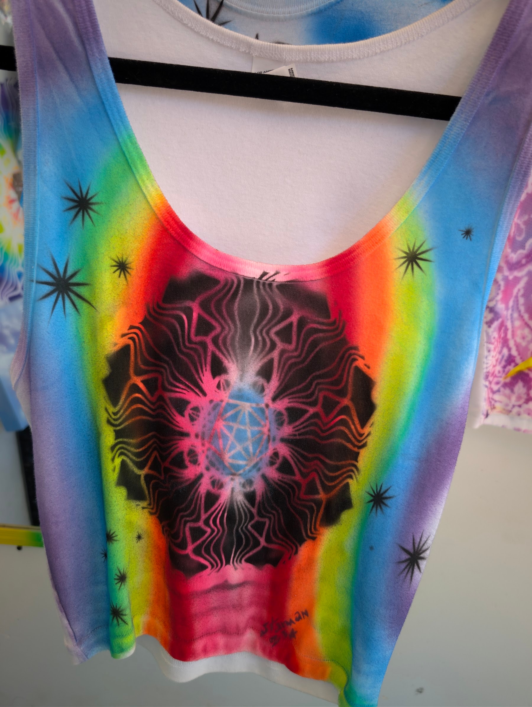 Hand-airbrushed tank with neon geometry by Star Shields